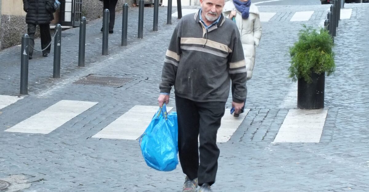 Random guy carrying a blue bag looks like he wife made him do it groceries blue old by rini chakraborty