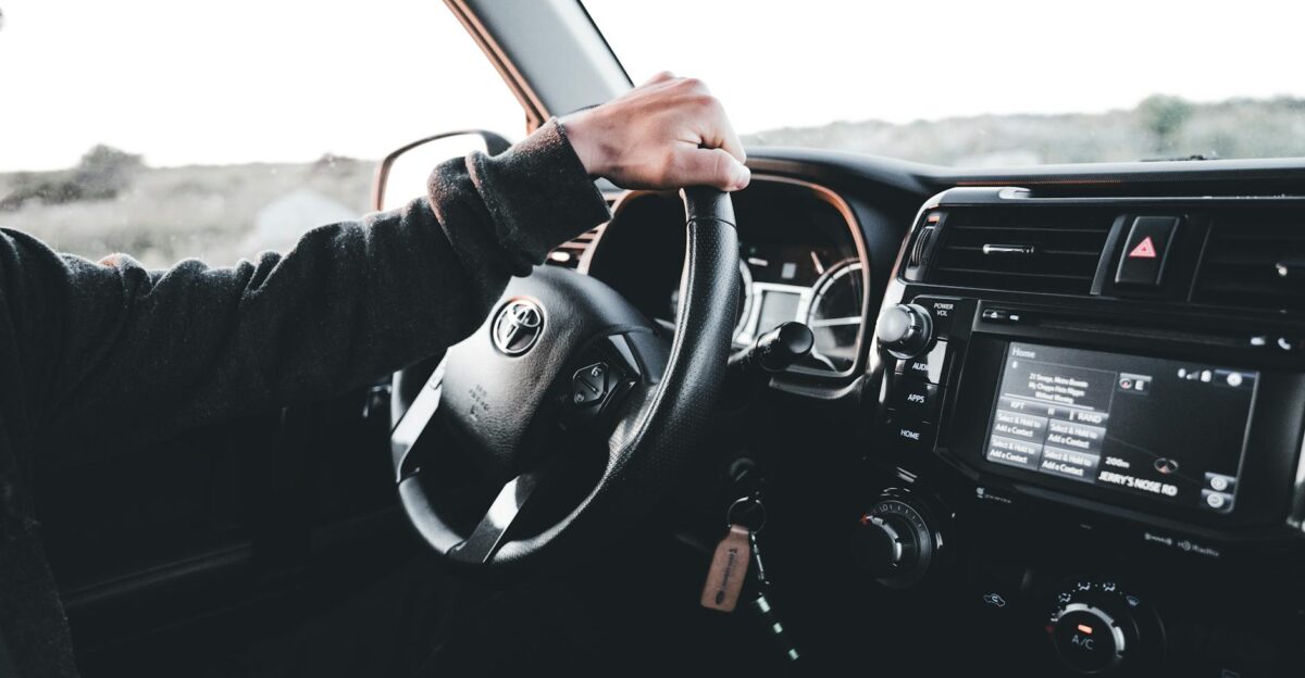 Hand Driving Toyota Car