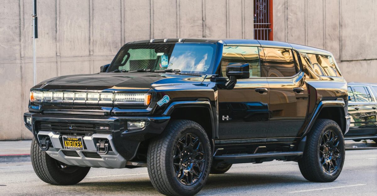 A modern Hummer EV parked on a city street showcasing sleek design and electric power