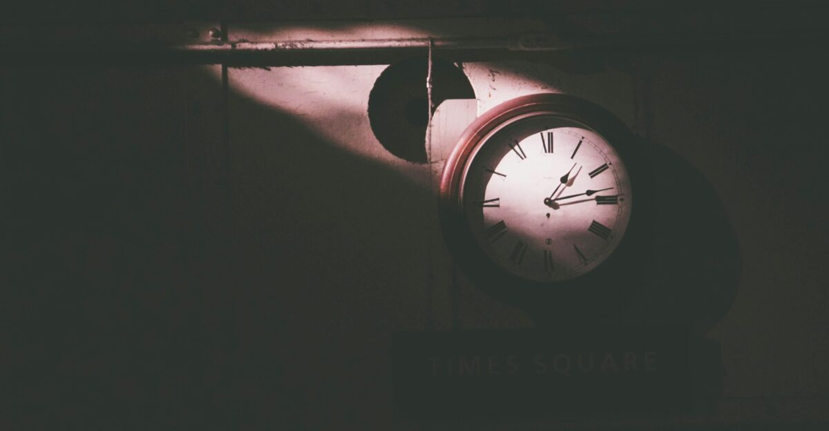 round white and brown wall clock