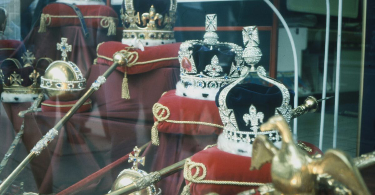 gold and red trophy on glass shelf