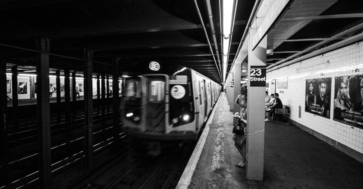 a black and white photo of a subway train