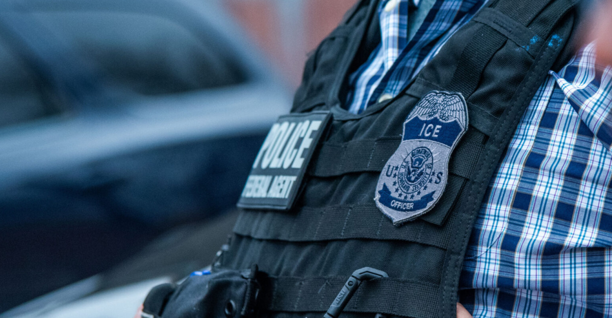 An ICE officer coordinates with other officials during an enforcement operation in San Antonio Feb. 5.