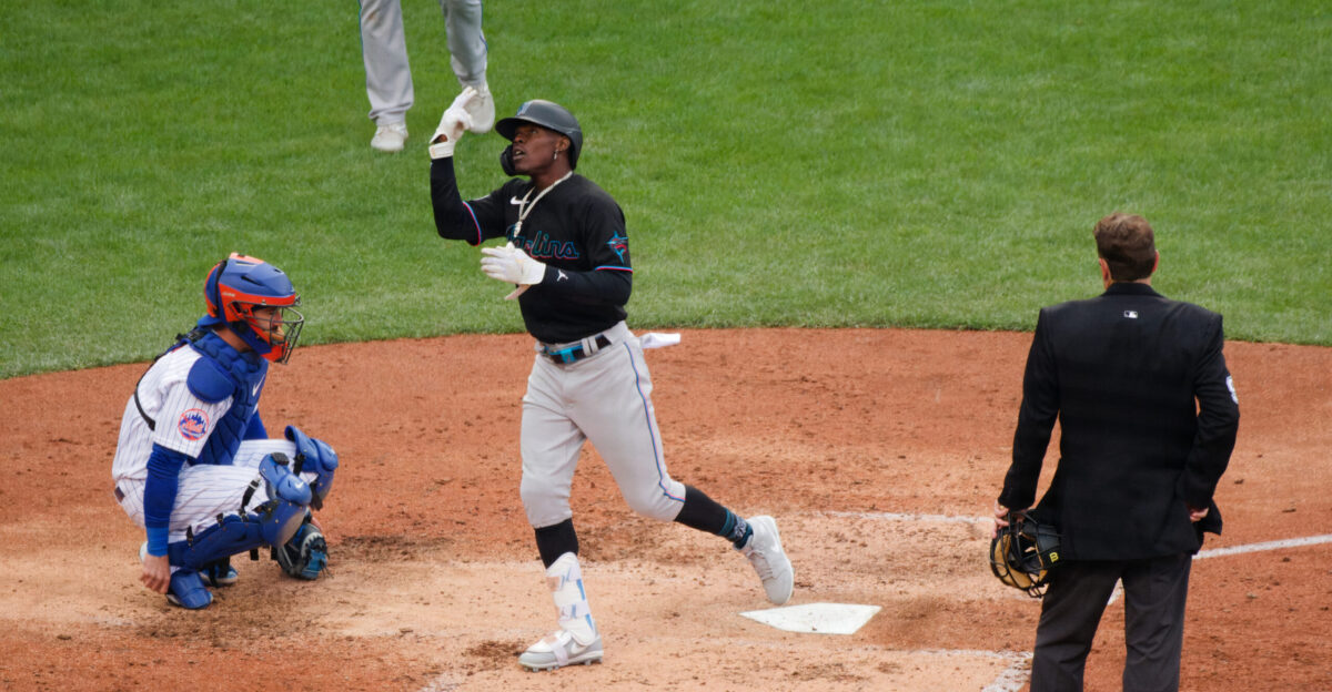 Jazz Chisholm Jr gestures after touching home plate