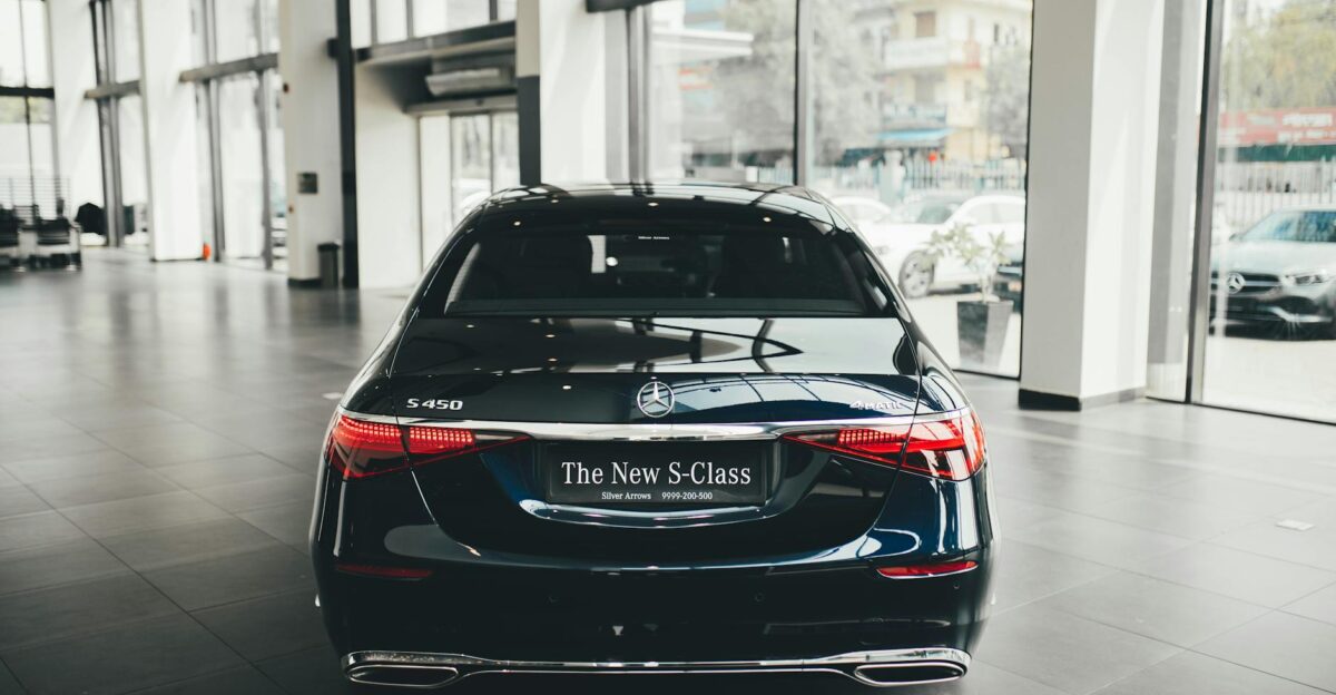 Rear view of a sleek Mercedes S450 in a modern car dealership showroom New Delhi