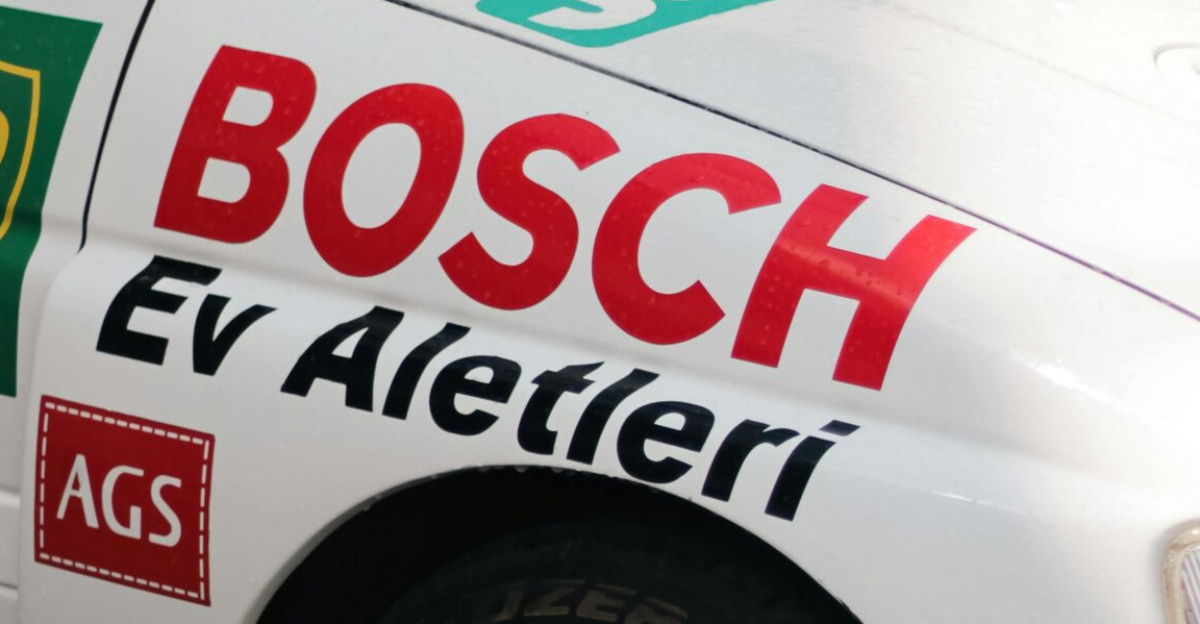 Detailed view of a rally car featuring various sponsor logos and performance elements.