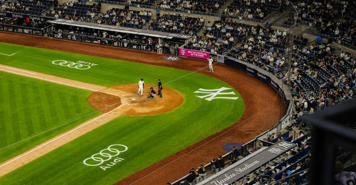 Aerial view of a baseball game at Yankee Stadium with a packed crowd