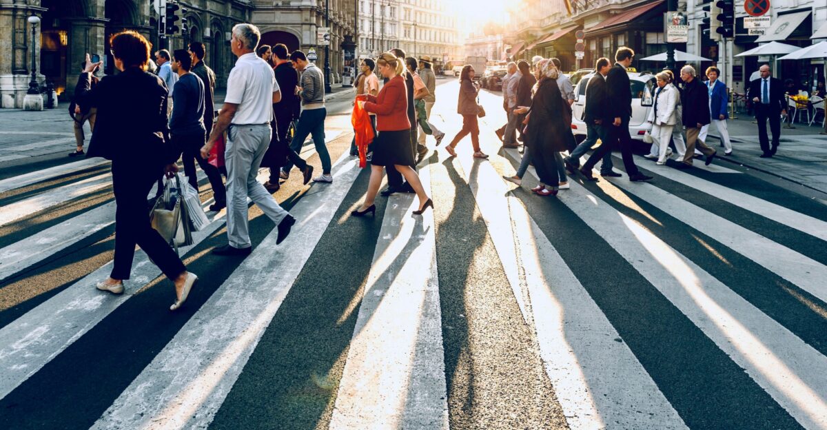 group of people walking on pedestrian lane