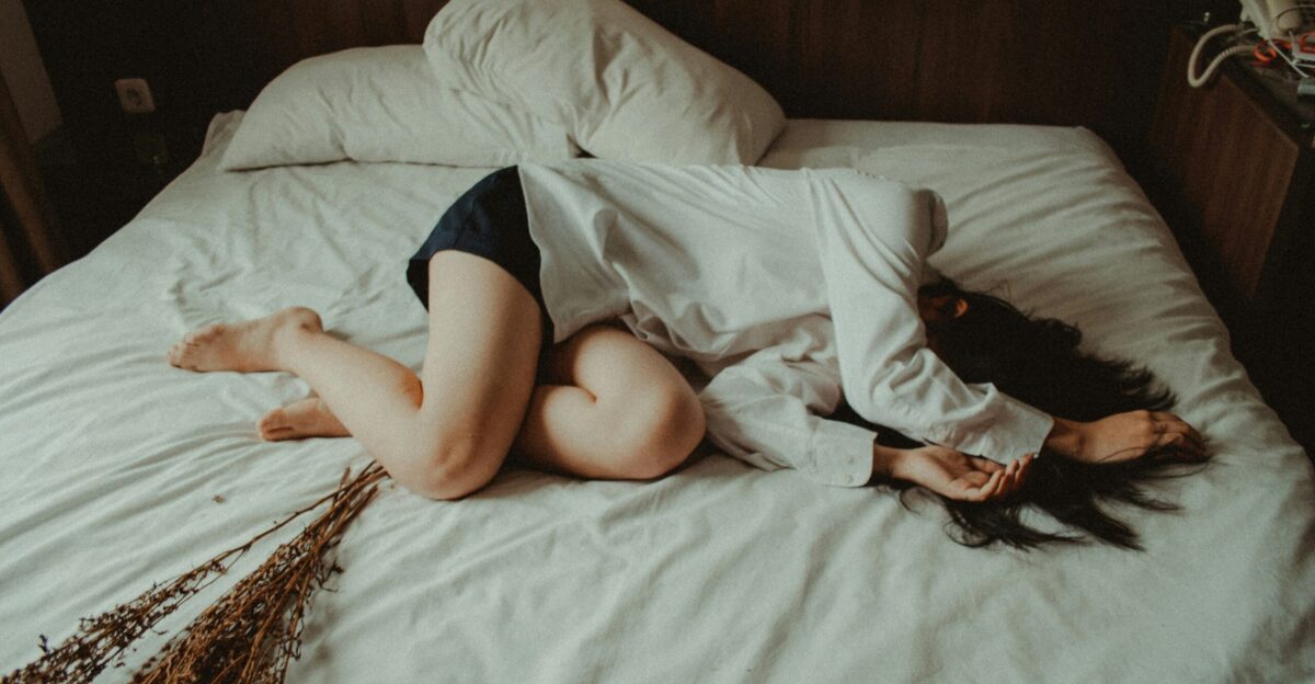 woman lying on bed