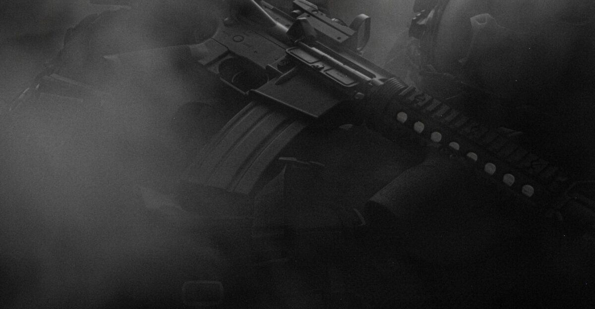 black assault rifle on black textile