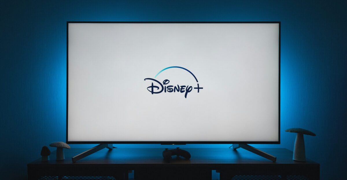 a flat screen tv sitting on top of a wooden table