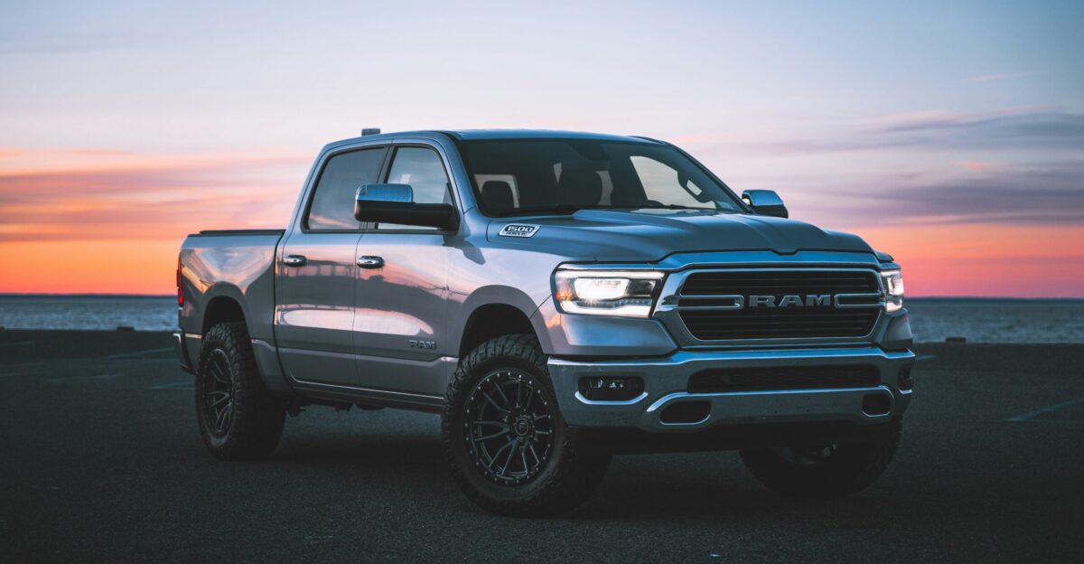a silver ram truck parked in a parking lot