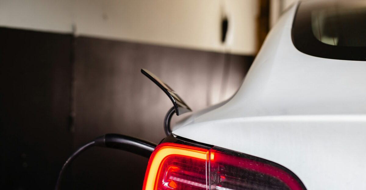 the tail light of a white car in a garage