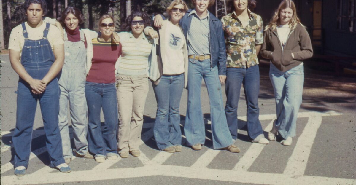 a group of people standing in a parking lot