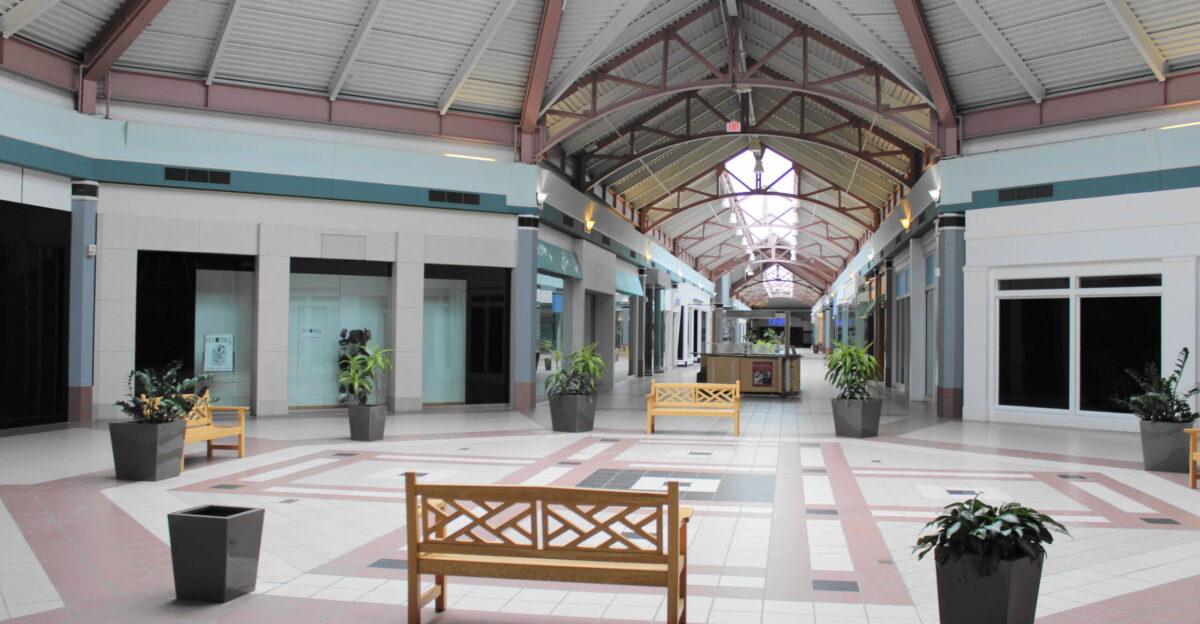 The center atrium of Steeplegate Mall as pictured on April 16 2022 All the interior-only businesses in the mall were closed by the time the picture was taken access to the interior was permanently closed to visitors six days later on April 22 The photographer is facing towards the west end of the mall with the former entrance to Sears in the background
