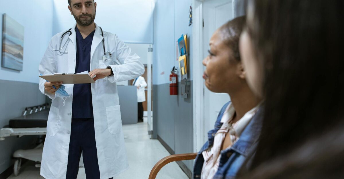 Doctor in a healthcare setting consulting patients promoting health and wellness