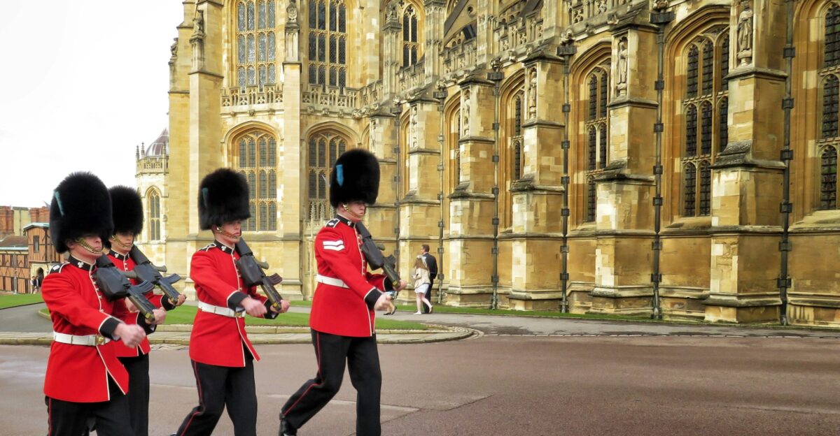 four Royal Guards marching outside palace