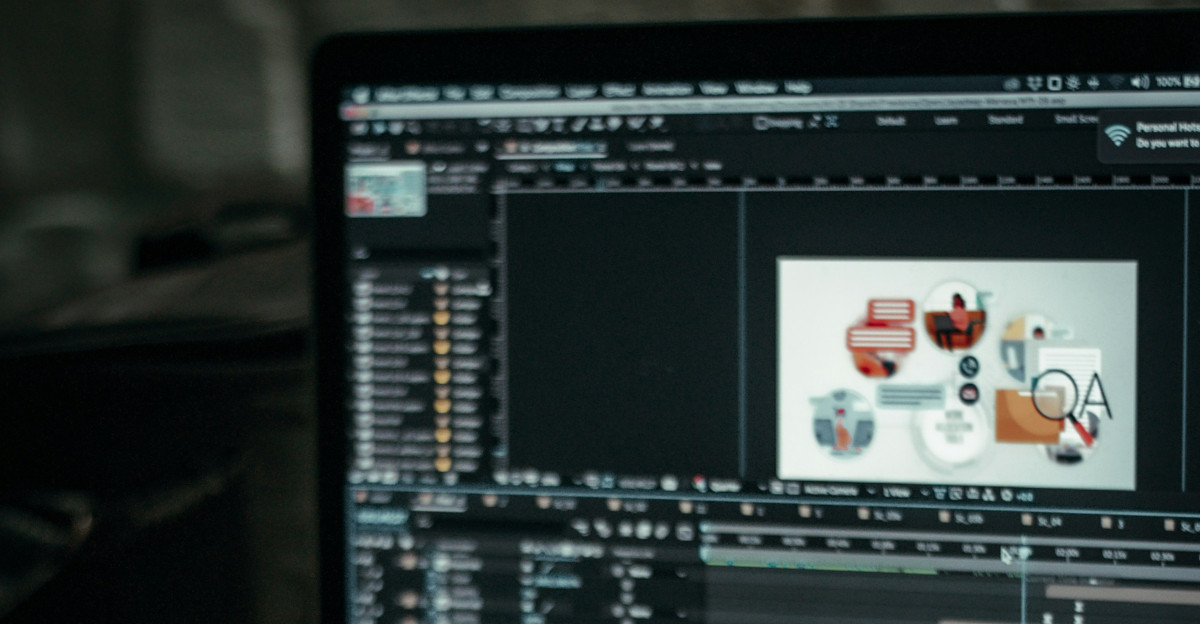 person using macbook pro on table