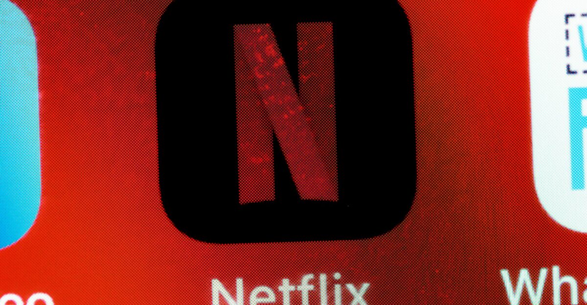 a close up of a cell phone with different logos on it